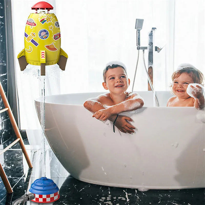 Yellow water pressure rocket launcher toy for kids outdoor garden play on a green lawn.