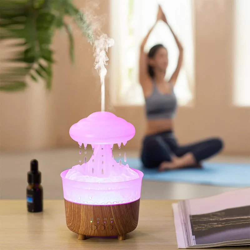 Wood grain rain cloud shaped humidifier diffuser with coloured LED light and water droplet sound.