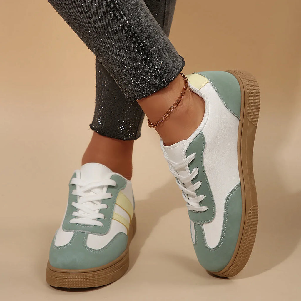 Women's low-top retro sports pumps in a candy colour with cross-strap detail on artificial PU upper.
