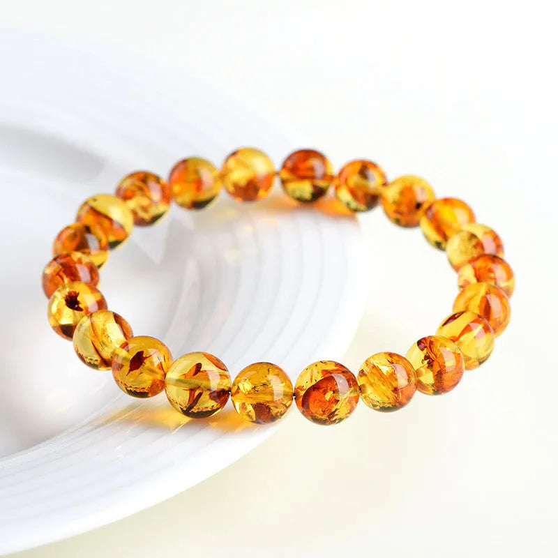 Natural yellow piebald amber bracelet with geometric beads and water purification properties