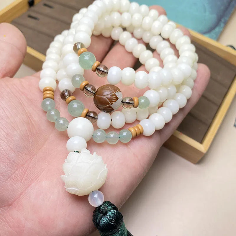 White jade Bodhi stone 108-bead bracelet in three style options with different bead sizes on a wrist.