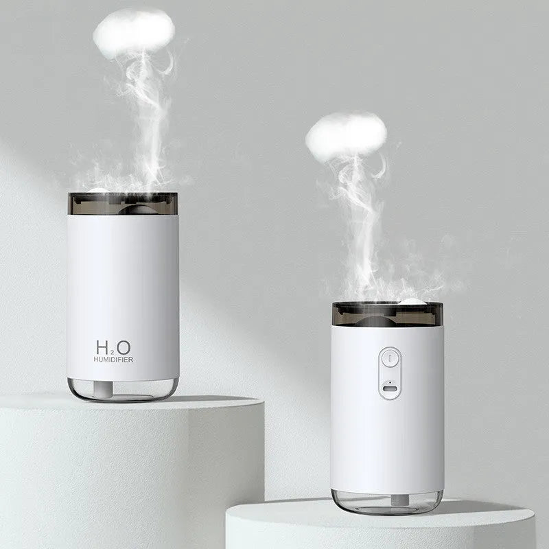 White jellyfish humidifier with blue lighting on wooden table showing mist emission