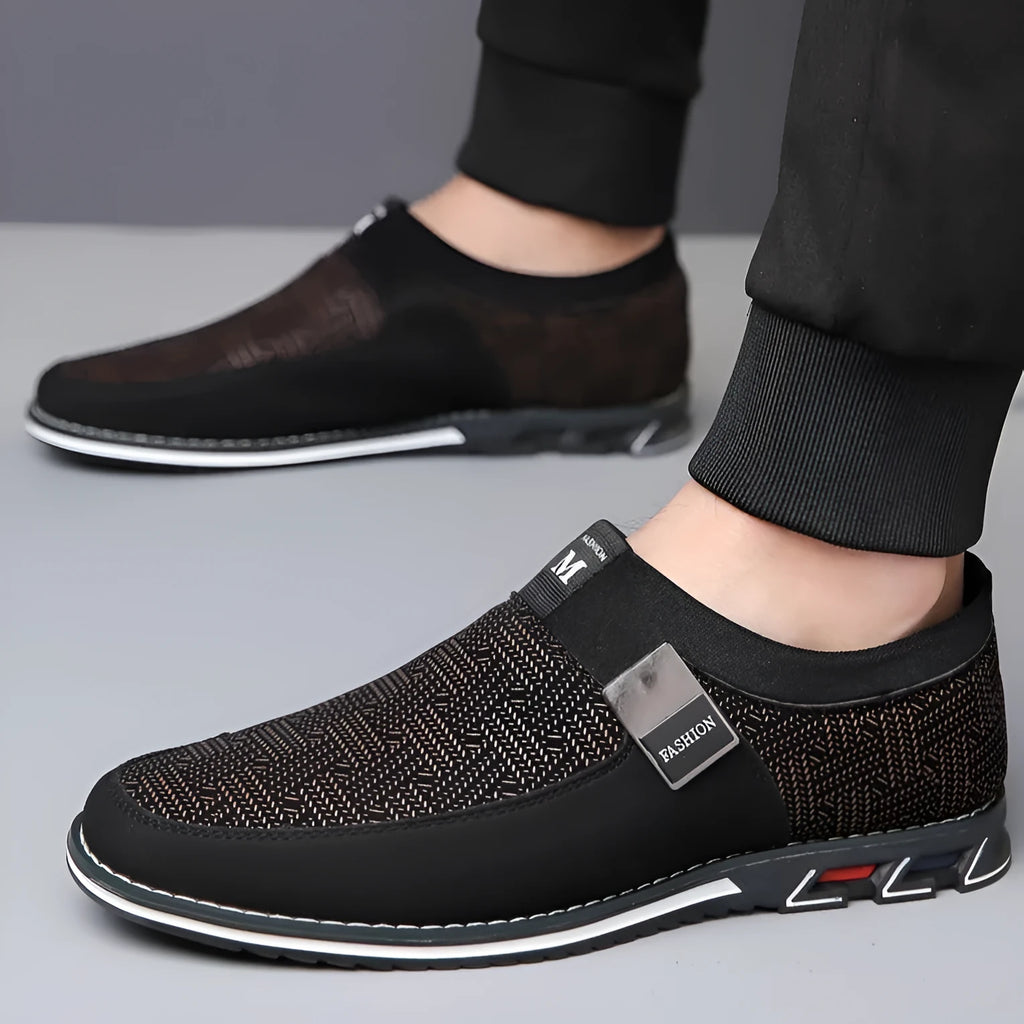 Men's grey and white square toe casual shoes with a low-top synthetic leather upper and flat rubber sole.