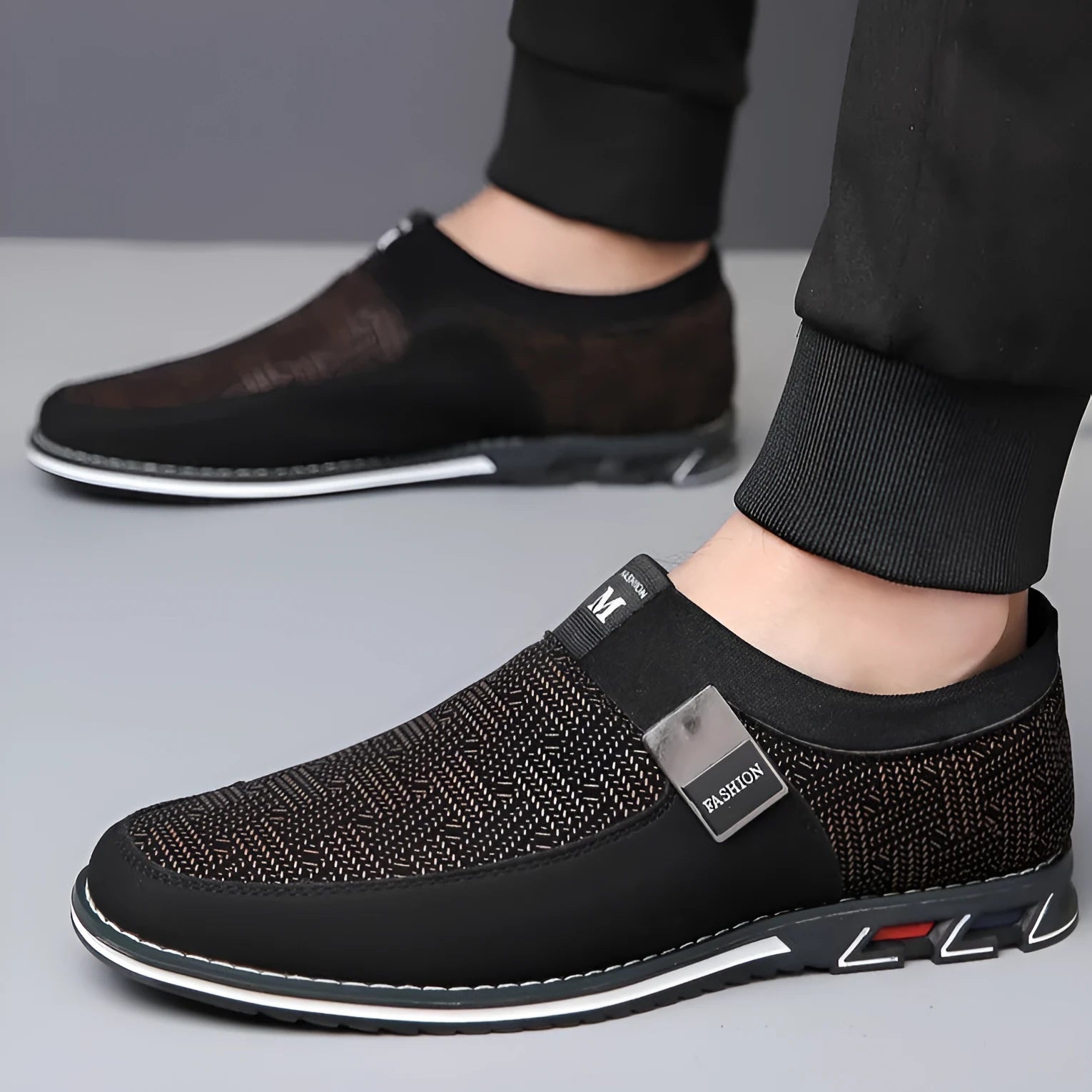 Men's grey and white square toe casual shoes with a low-top synthetic leather upper and flat rubber sole.
