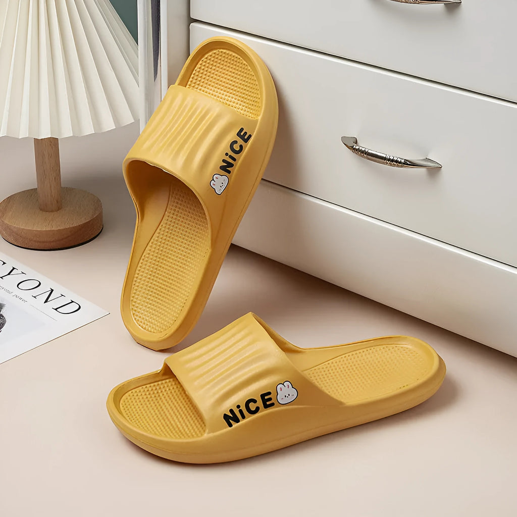 Adult unisex EVA flip-flop slippers with cartoon pattern in various colours on non-slip sole.