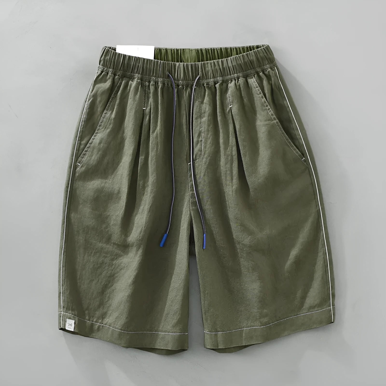 Men's loose straight linen shorts in black or green with drawstring waist
