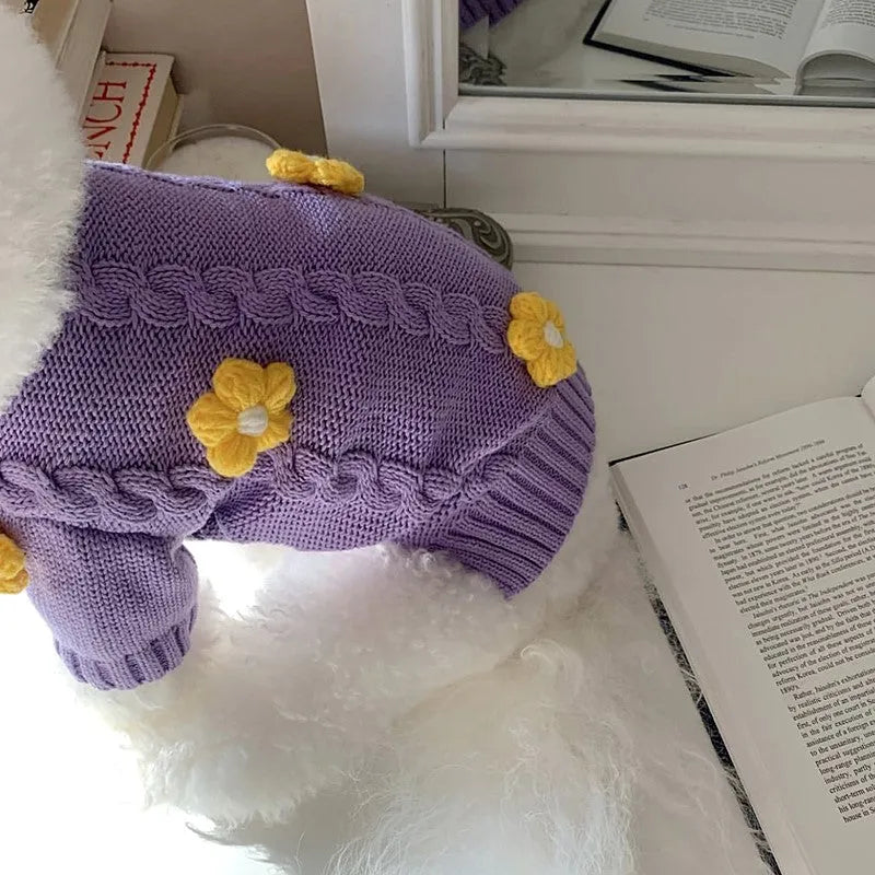 Purple knitted dog clothing with floral pattern showing size options for small pets