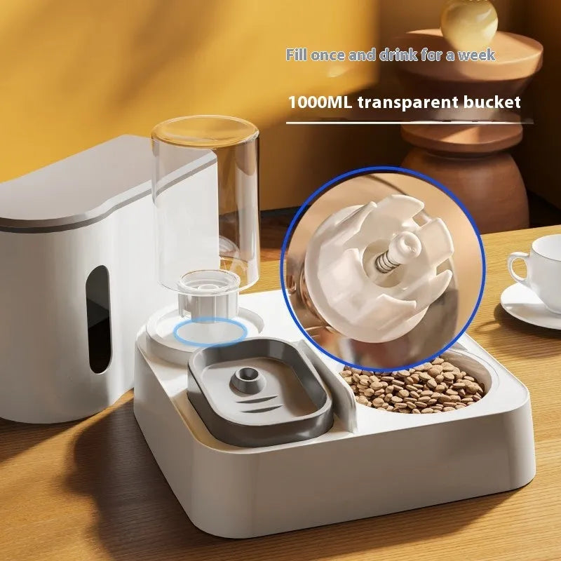 Gray automatic cat feeder with double bowl system showing food and water compartments