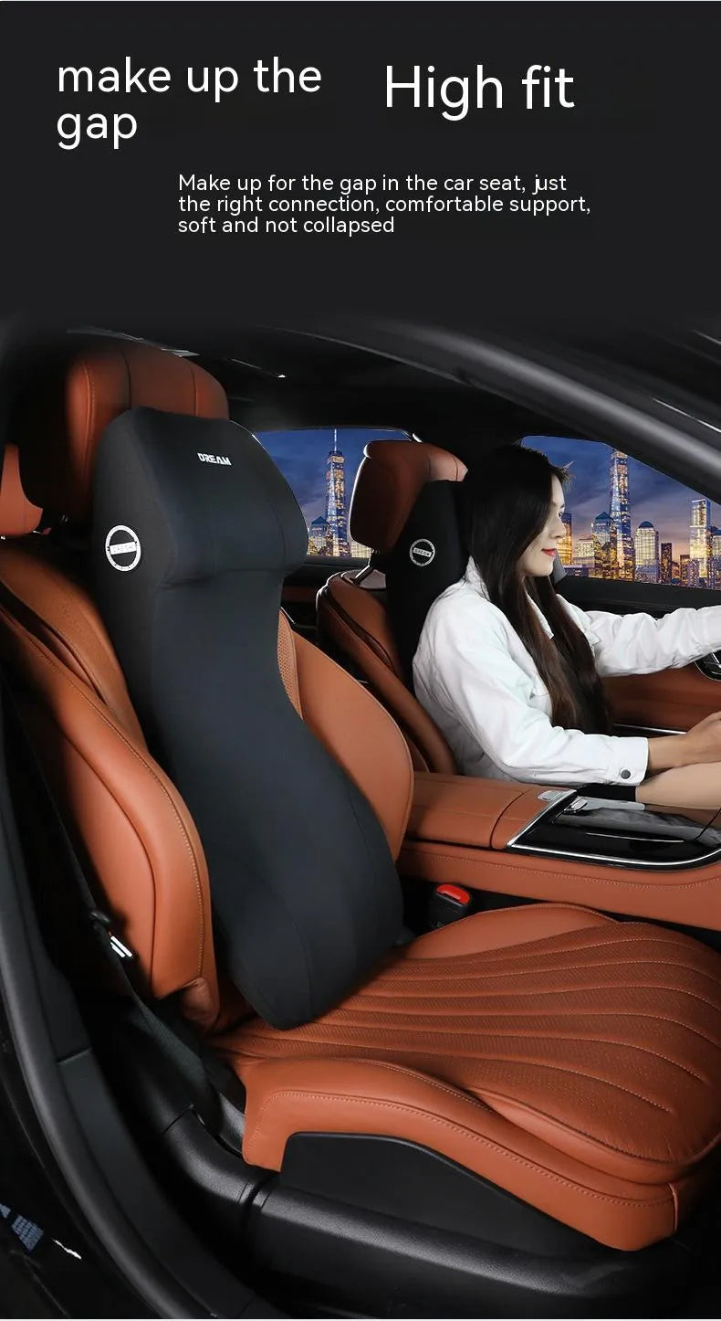 Black automotive memory foam cushion mat with integrated headrest and lumbar support pillow on a car seat.
