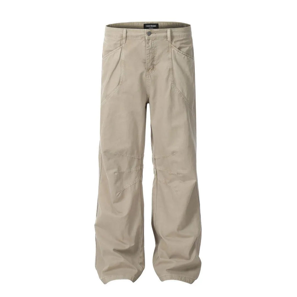 Men's brown straight-leg trousers with high waist and non-ironing cotton fabric on a hanger