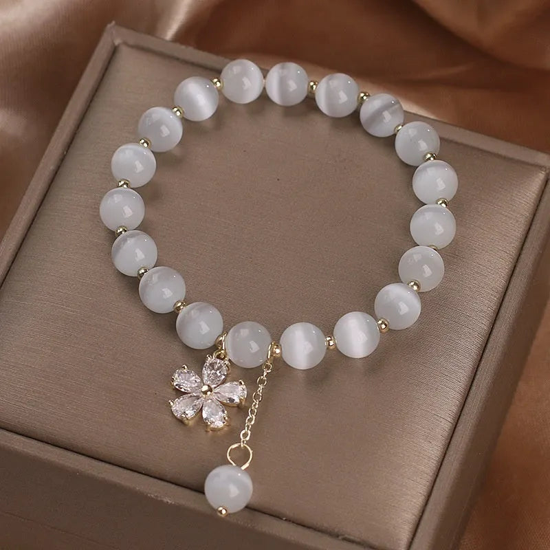 White cat's eye crystal women's bracelet with morganite safety buckle pendant and small flower tassel