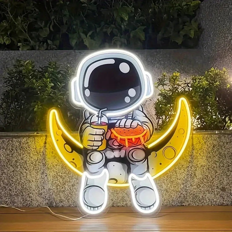 Astronaut-shaped LED neon wall light with moon background, measuring 30 cm by 35 cm.