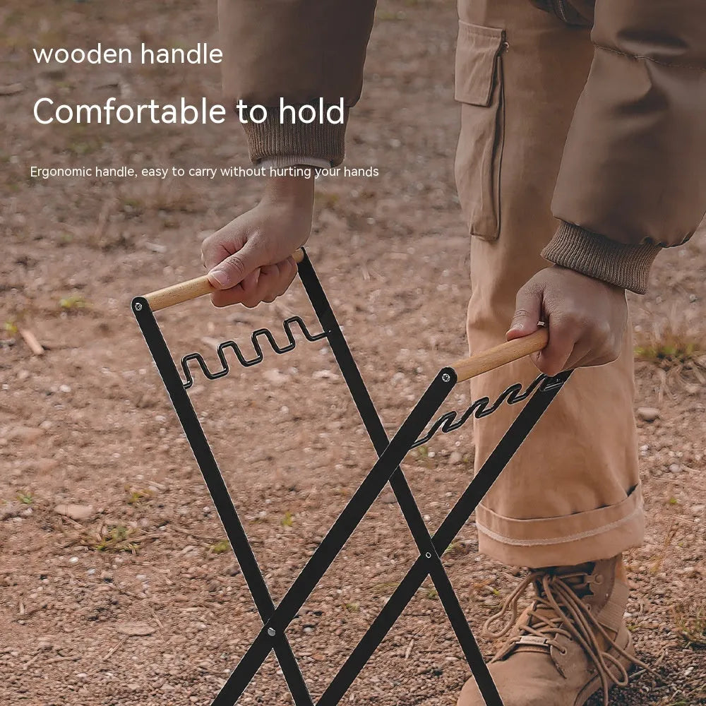 Black folding iron trash rack with wood handle holding bin bag outdoors