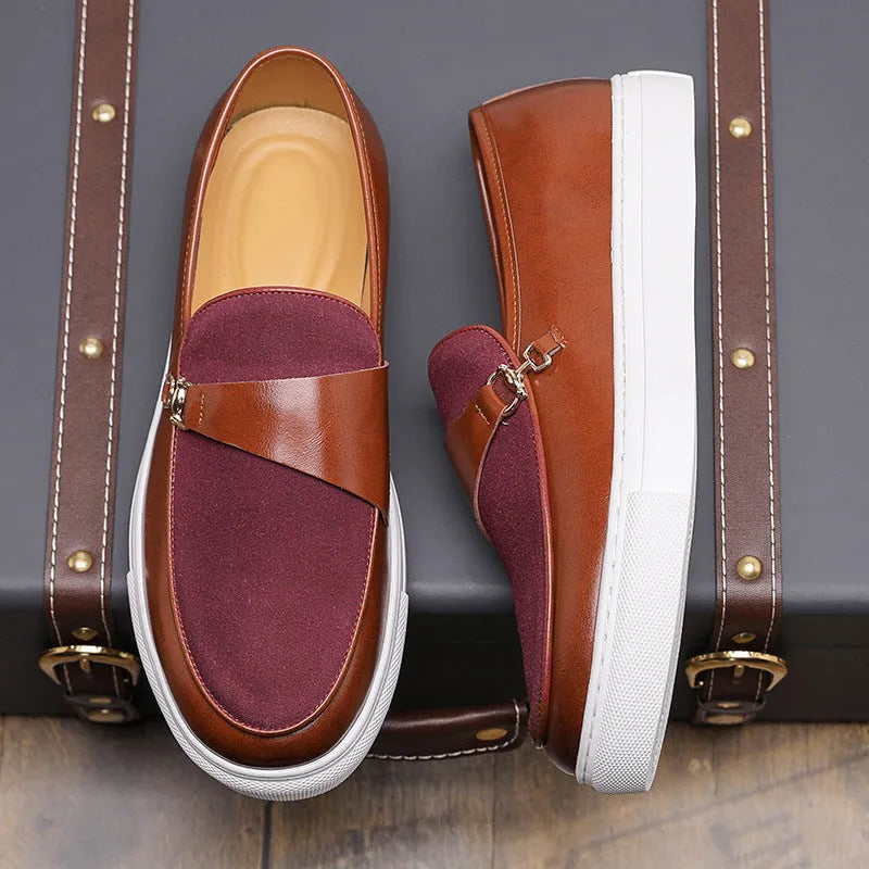 Men's black slip-on loafer with a gold horsebit buckle, round toe, and visible stitching.