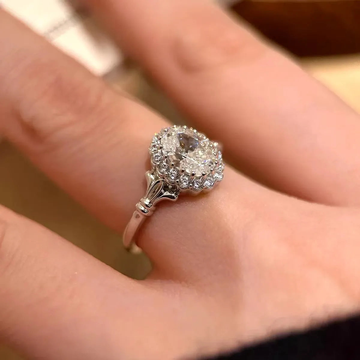 Silver adjustable geometry ring with diamond treatment and ellipse design elements for female wearers