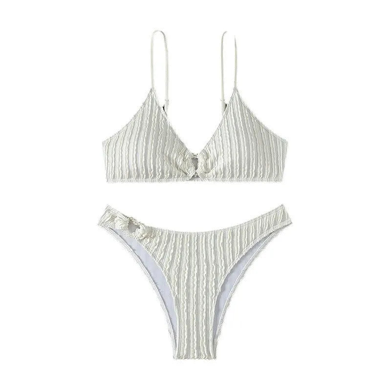 Women's white V-neck split swimsuit with sleeveless design, top and shorts set for beach swimming