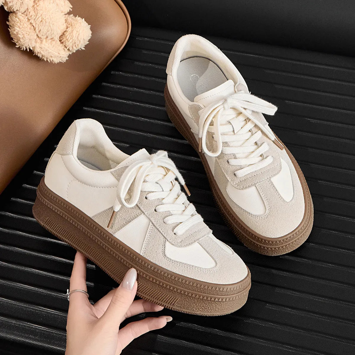 Retro round toe board shoes with cross shoulder straps in milky white, showing front lace-up detail.