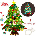 Green DIY felt Christmas tree with fairy-tale lights mounted on wall with decorative ornaments