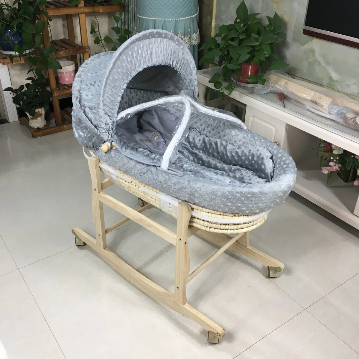 Portable multifunctional cradle bed with mosquito net and mat, in silver or white, with optional pine frame.