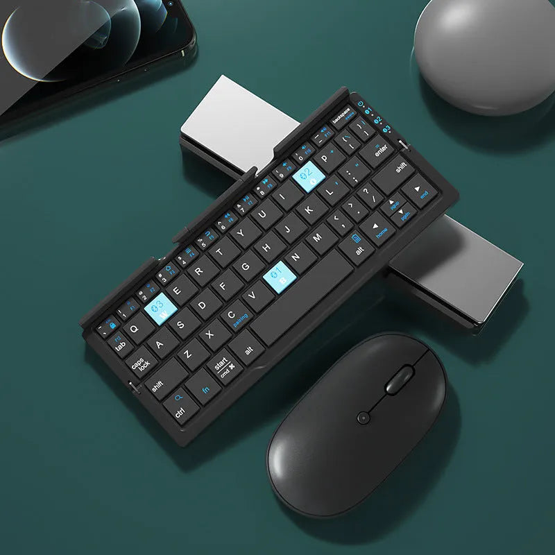 Silver white folding Bluetooth keyboard shown open with stand holding a smartphone, and folded next to a ruler for scale.