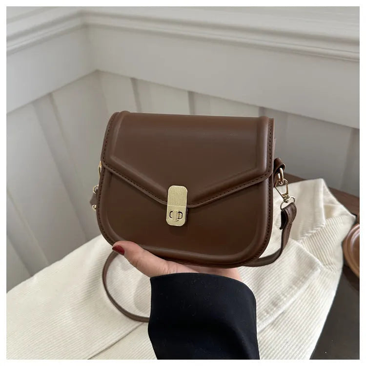 Niche Texture Shoulder Messenger Bag in clamshell design with soft PU material, shown in horizontal square shape.