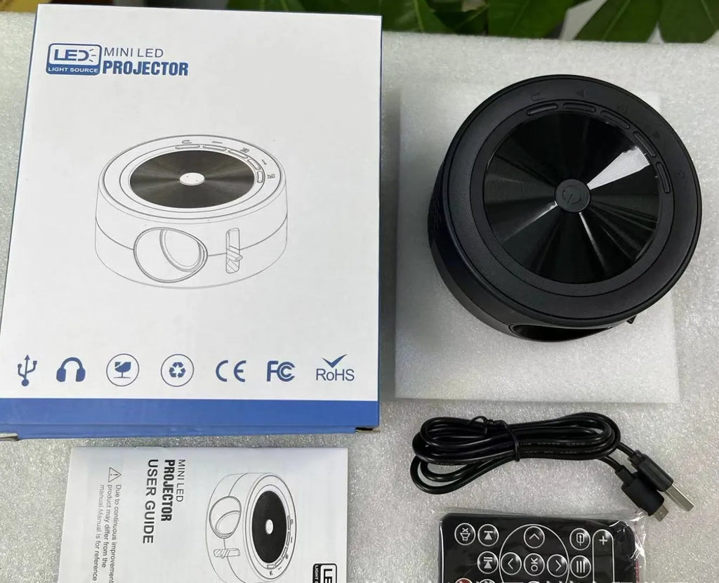 YT200 portable LED projector in black, white, blue and white, or yellow and white colour options
