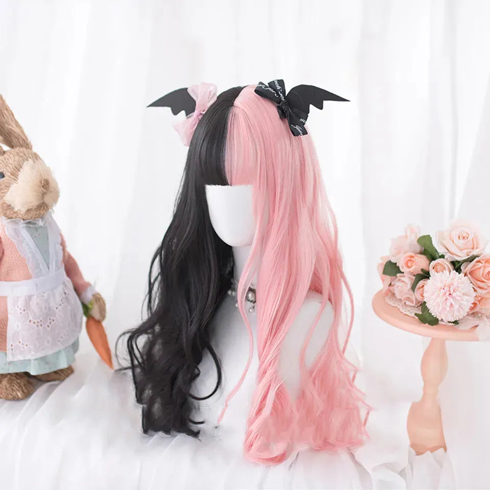 Harajuku Japanese Lolita long curly wig in black and pink colours with bangs on a wig stand.