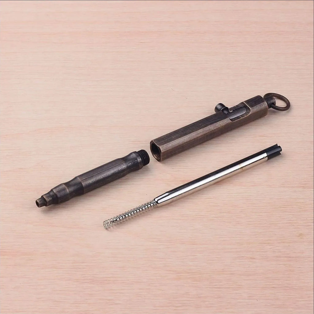 Vintage brass hexagonal bolt action tactical pen in natural brass and retro black colours.