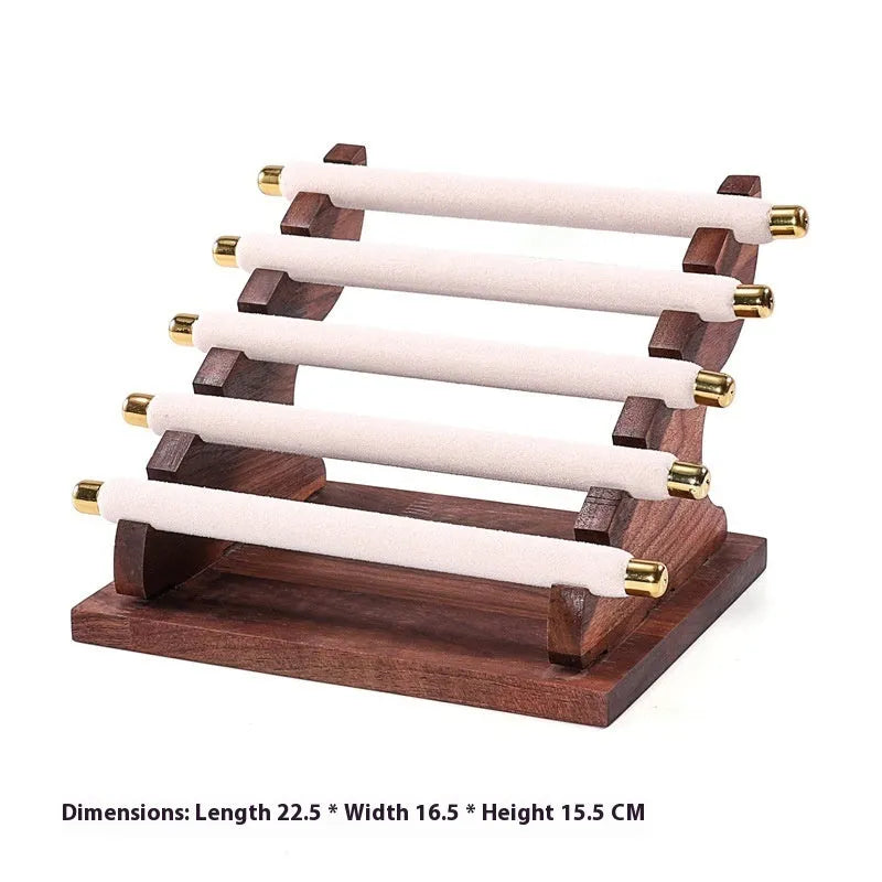 Solid wood trapezoid ring display stand with multiple fabric-lined layers in walnut finish