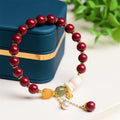 Natural Tian Yu cinnabar bracelet in purple gold sand colour with rabbit design, shown in 8mm and 10mm width options
