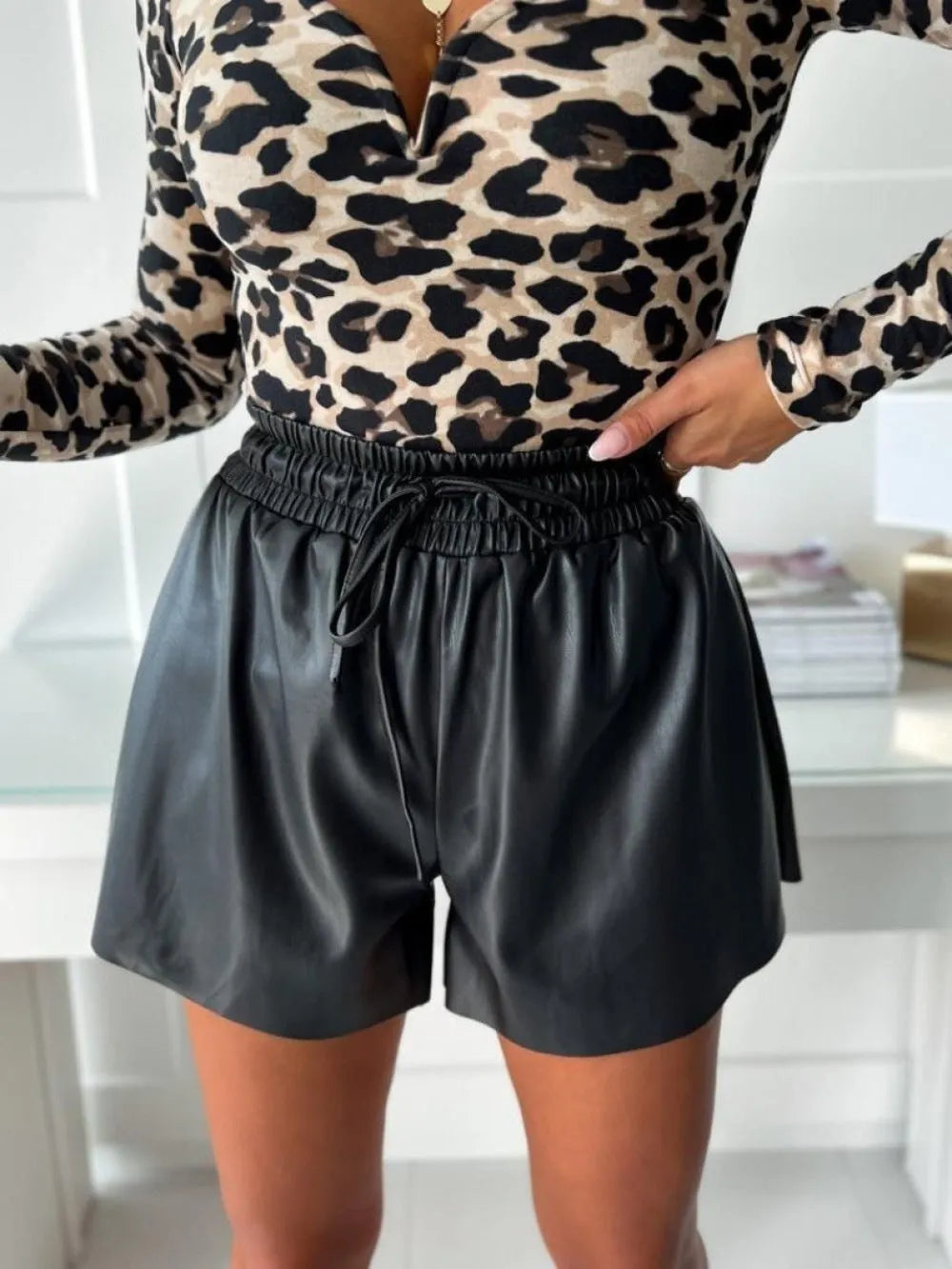 Women's black drawstring lace-up PU leather wide-leg casual shorts with straight-leg design and mid-waist fit