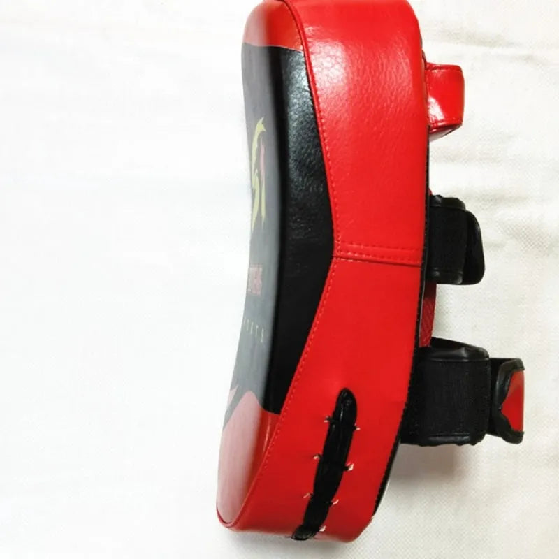 Black and red hand-held martial arts target pad showing double buckle strap on back