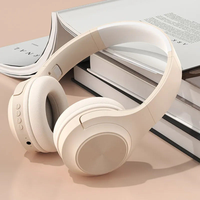 Wireless Bluetooth headset with creative design in ivory white colour, showing head-mounted wearing style