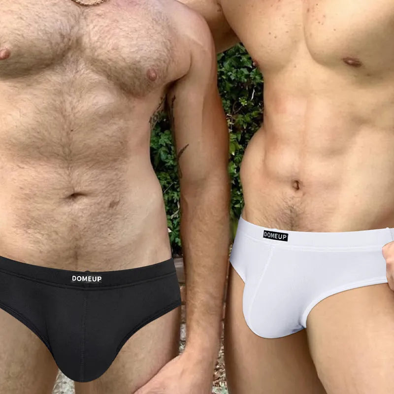 Men's solid colour seamless low-waist briefs in knitted polyester fabric.