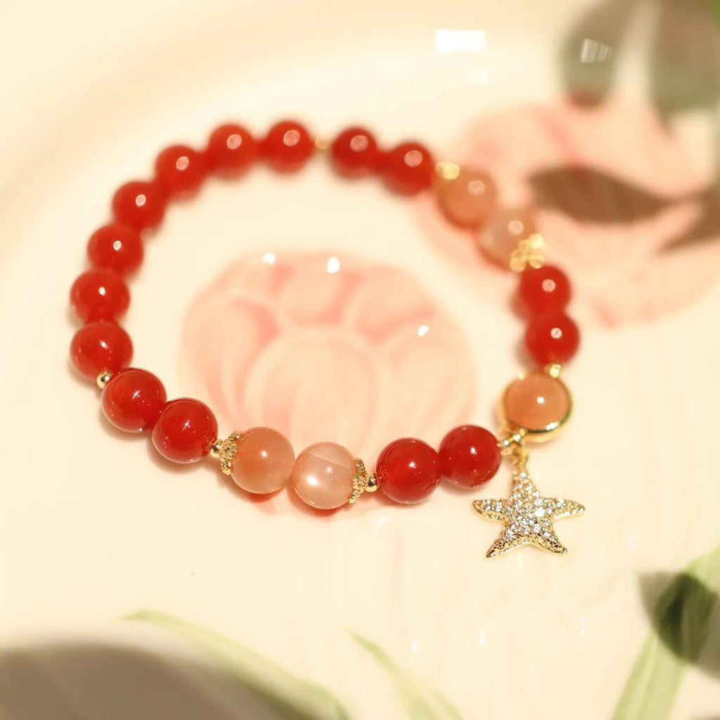 Handmade women's 8mm red agate and sunstone bracelet with xiangyun patterns in ethnic style