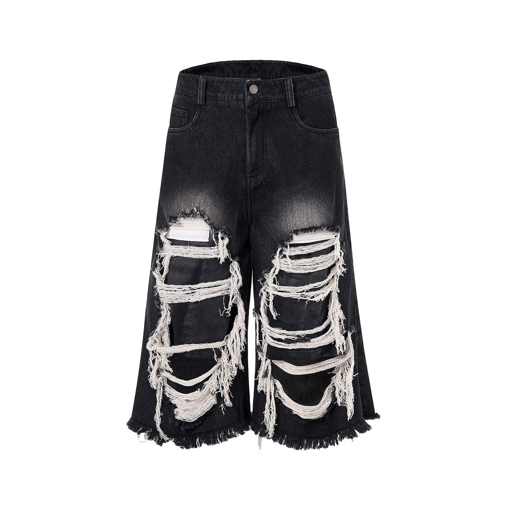 Black cropped wide-leg jeans with mid-high waist, showing loose fit and micro-elastic cotton fabric