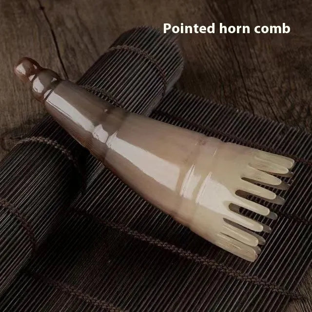 White buffalo horn comb with wide teeth and pointed tip for detangling and scalp massage, 18cm length.