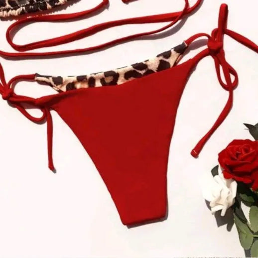 Women's leopard print halter bikini with lace-up detailing in red or black colours
