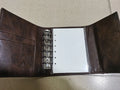 A7 brown PU notebook with loose-leaf binder binding showing 40g raw wood pulp paper inside