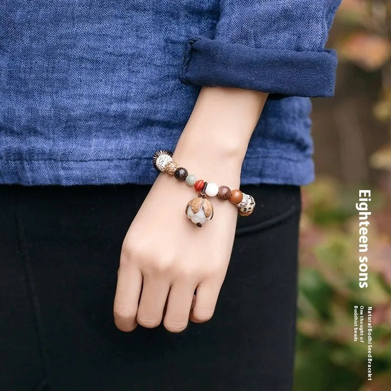 Geometric Bodhi seed bead bracelet with 18 beads on a wrist, showing a 16cm unisex fit.