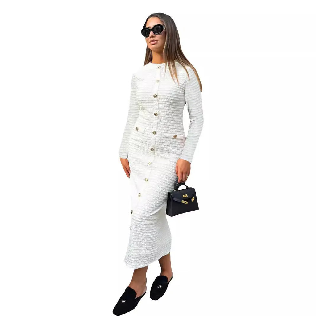 Retro French slim fit knitted long sleeve dress in black with button detail and a one-step skirt.