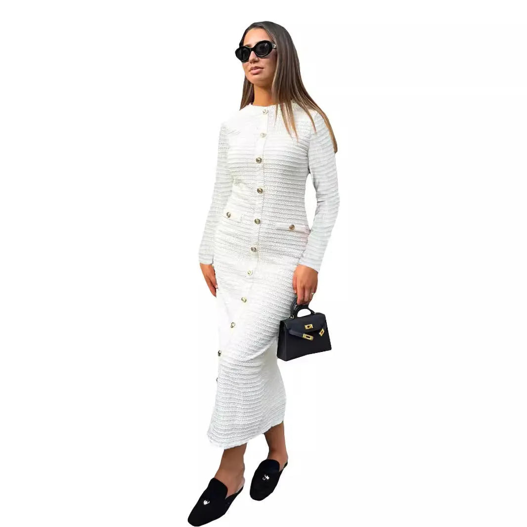 Retro French slim fit knitted long sleeve dress in black with button detail and a one-step skirt.