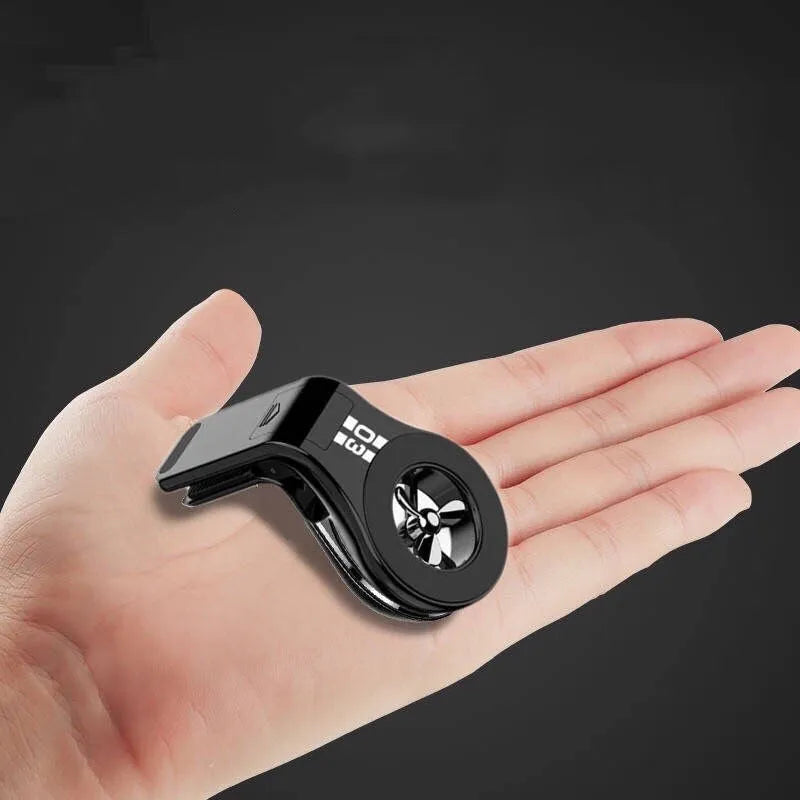 Magnetic car phone holder mounted on air vent with phone attached, showing 360-degree rotation and fragrance slices