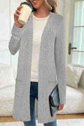Long sleeve loose pockets knitted cardigan jacket in black colour showing front cardigan design and pocket details