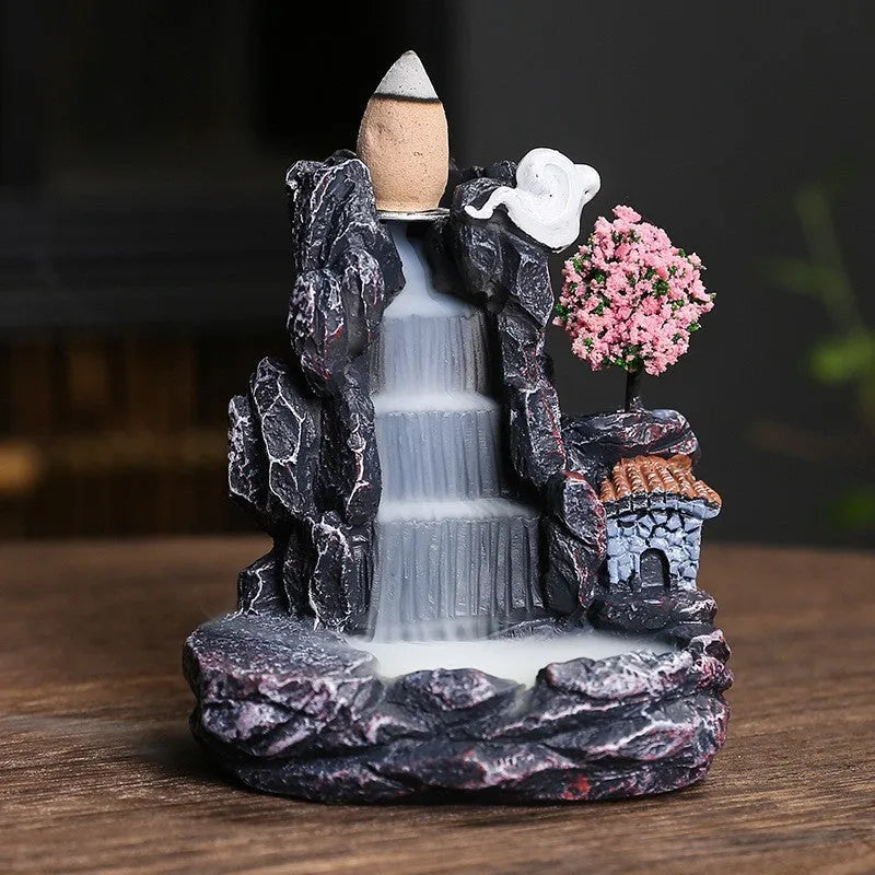 Modern ceramic backflow incense burner with sandal ornament in green tree design.