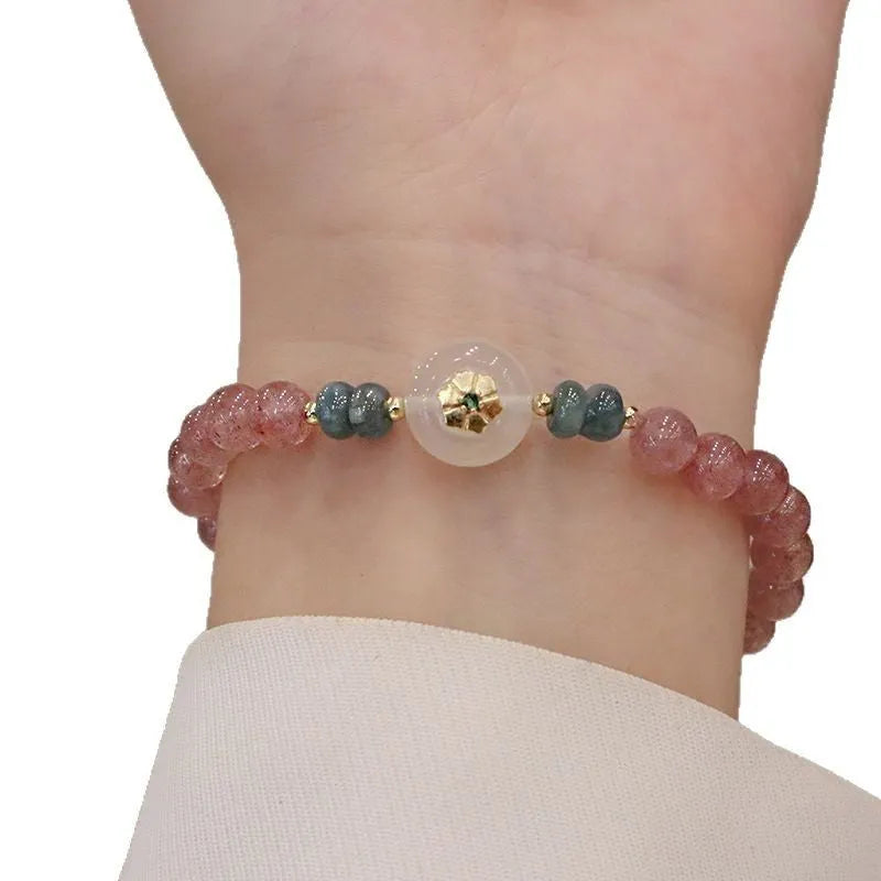 Women's strawberry quartz bracelet with blue water emerald pendant and peace buckle clasp