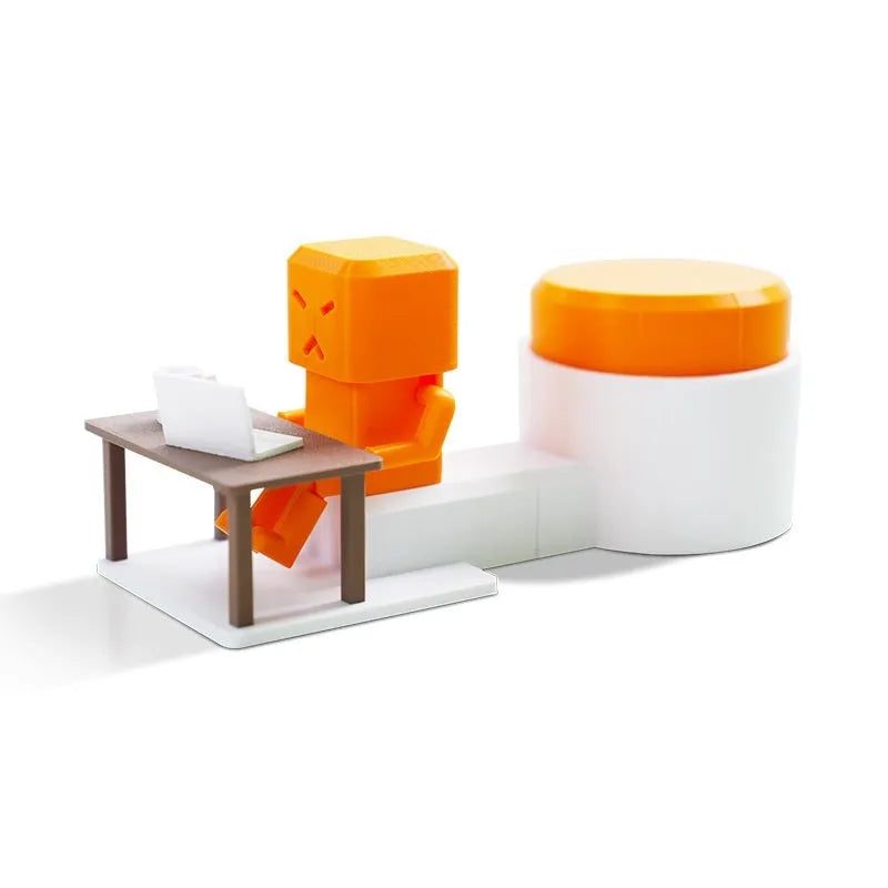 Orange plastic table-turning decompression toy measuring 16x6x7cm on wooden desk