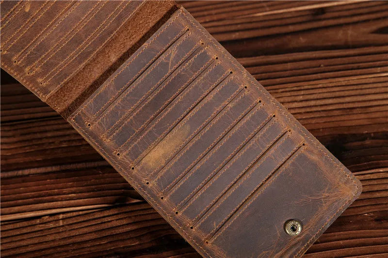 Men's long cowhide leather wallet showing card slots, money pocket, and mobile phone compartment.