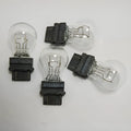 Wagner automotive brake light bulb with yellow glass and 16mm metal socket