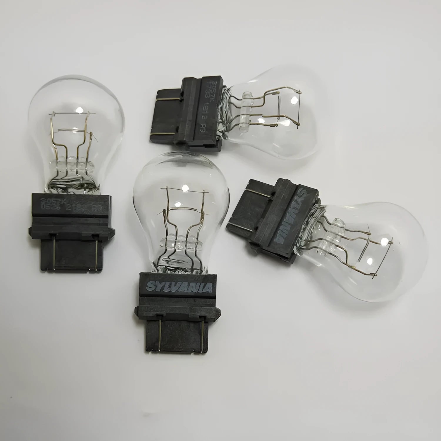Wagner automotive brake light bulb with yellow glass and 16mm metal socket